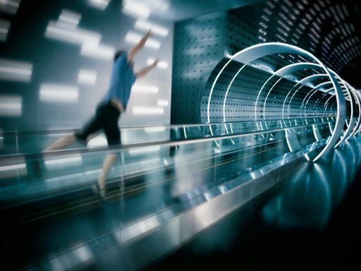 man jumps on escalator